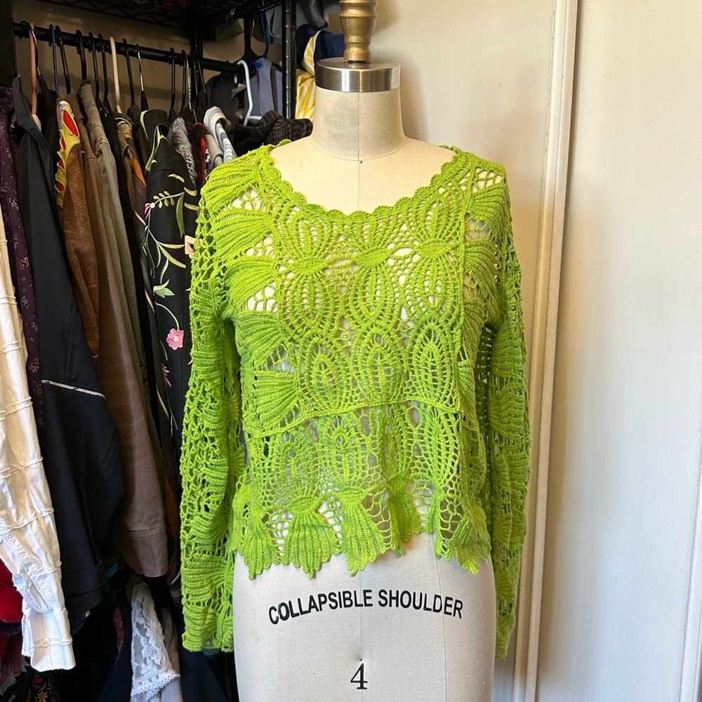 Green crochet top with a lace design